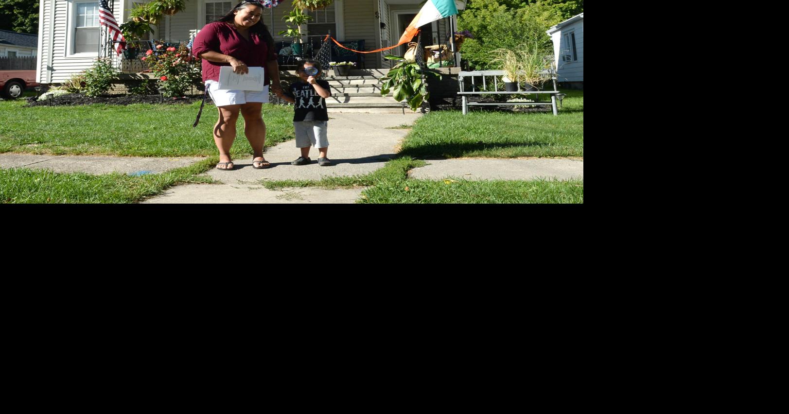 Two Auburn families move into renovated Habitat for Humanity homes