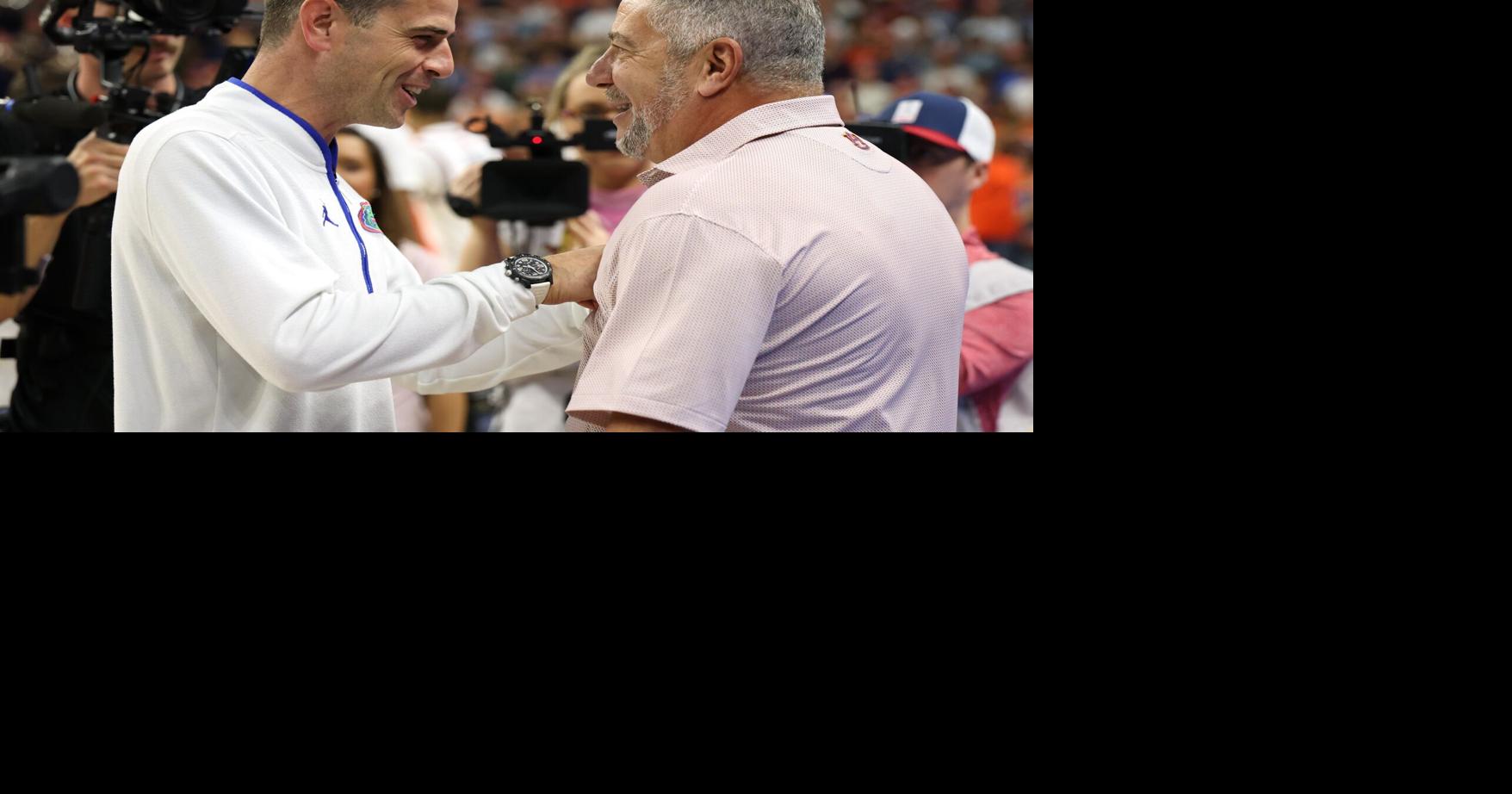 Feb 8, 2025; Auburn, Alabama, USA; Florida Gators head coach Todd Golden talks with Auburn Tigers head coach Bruce Pearl before their game at Neville Arena. Mandatory Credit: John Reed-Imagn Images
