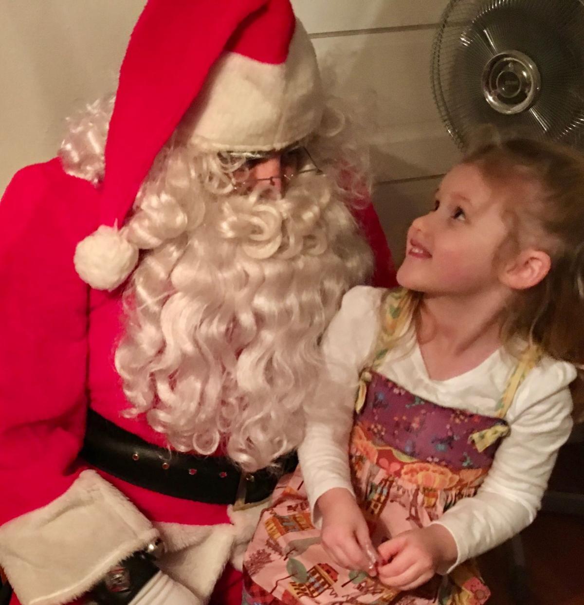 Santa Claus visits with children at Marcellus Historical Society's