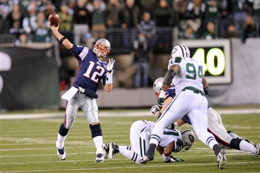 New England Patriots Tom Brady throws a pass in the first half against the  New York Jets in week 12 of the NFL at MetLife Stadium in East Rutherford,  New Jersey on