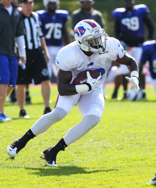 Buffalo Bills' Kyle Williams pulls on his jersey during an NFL football  training camp in Pittsford, N.Y., Sunday, July 31, 2011. (AP Photo/David  Duprey Stock Photo - Alamy