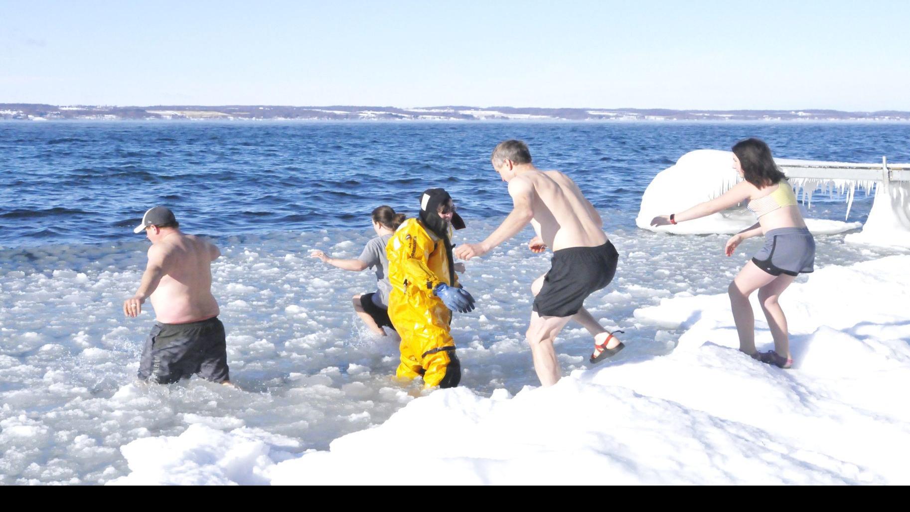 Few Bear The Annual Aurora Polar Plunge To Celebrate New Year