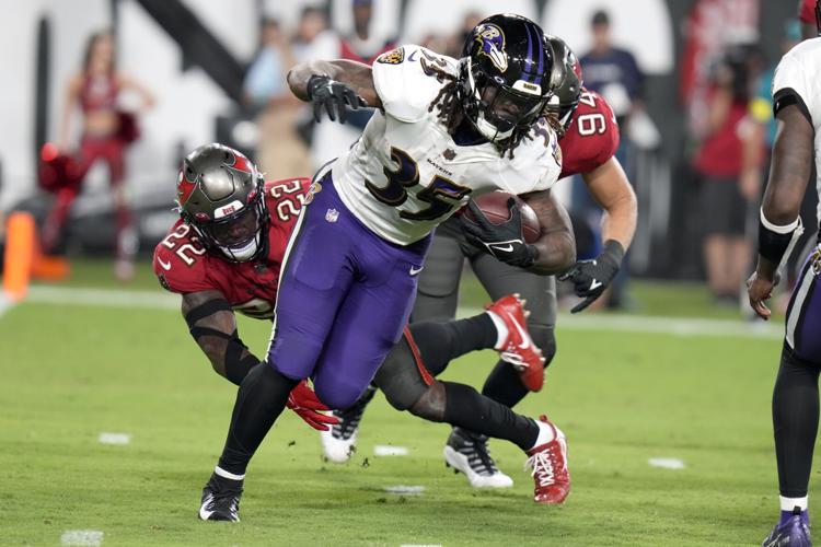 Jackson shines, Ravens beat Brady, struggling Bucs 27-22, Local