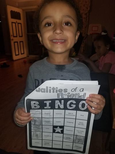 kid with bingo card.jpg