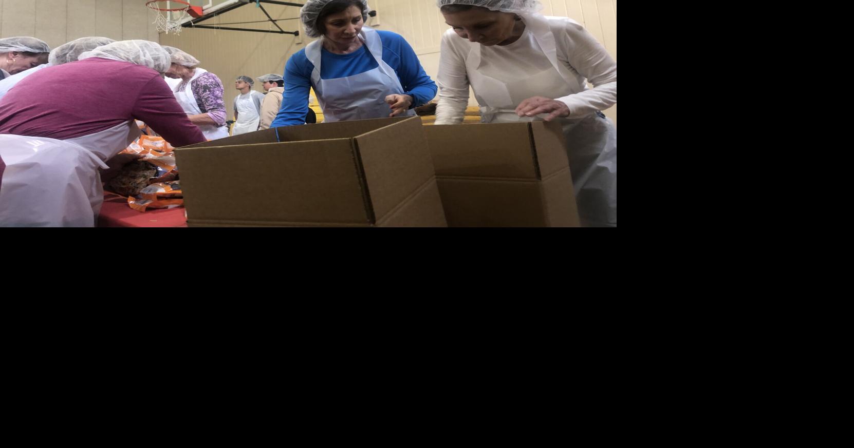 Neighbors near and far pack 150,000 summer meals for Avery families