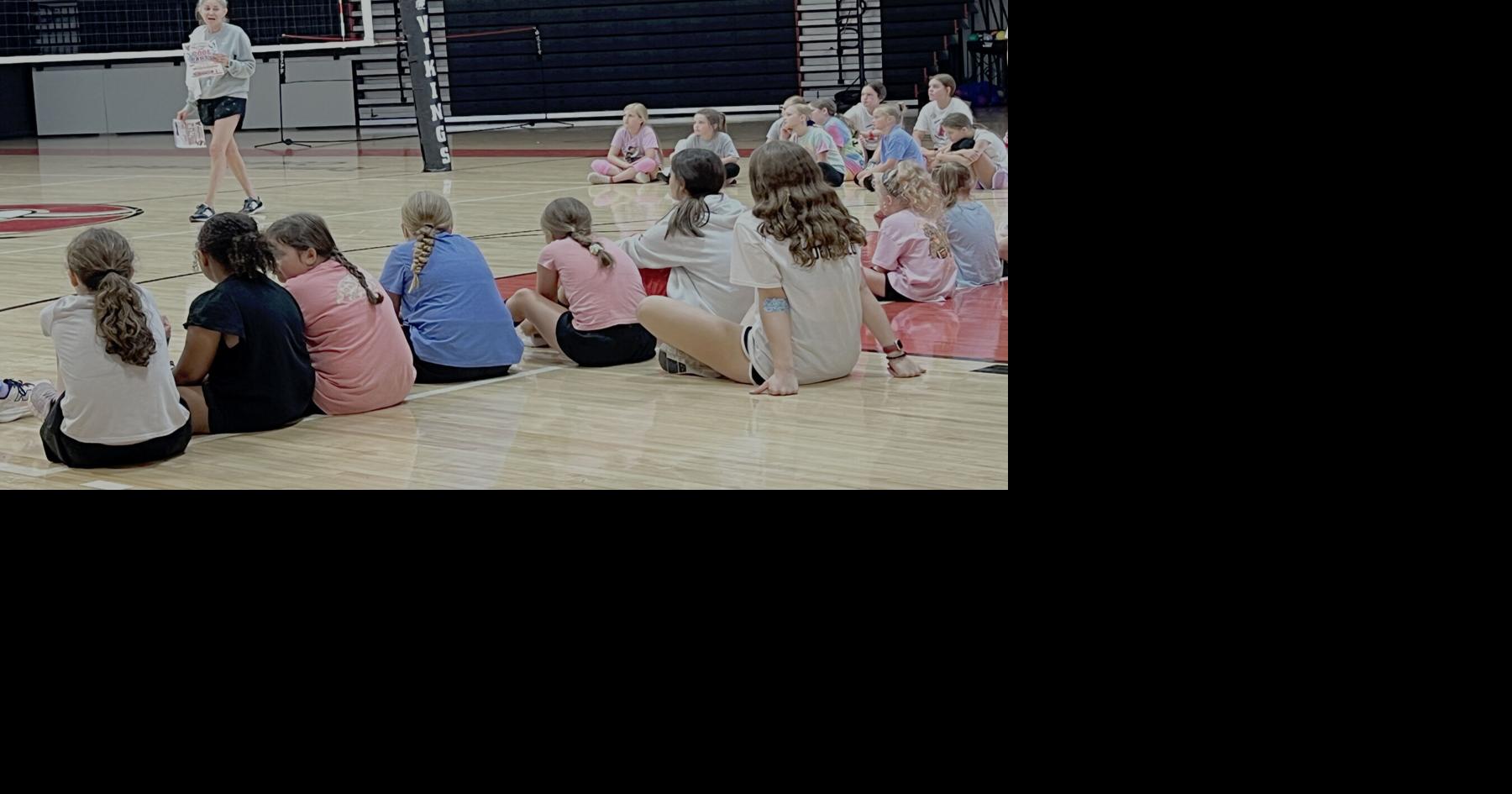 Avery Lady Vikings Varsity Volleyball Head Coach Erika Eller speaks with campers during a break in activities.jpg