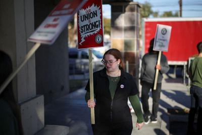 Baristas picket in front of a Starbucks in Burbank