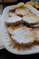 Citrus tartlets combine tangy lemon and orange bites in a buttery pastry
