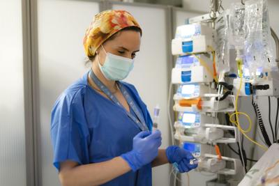 Nurse preparing syringe