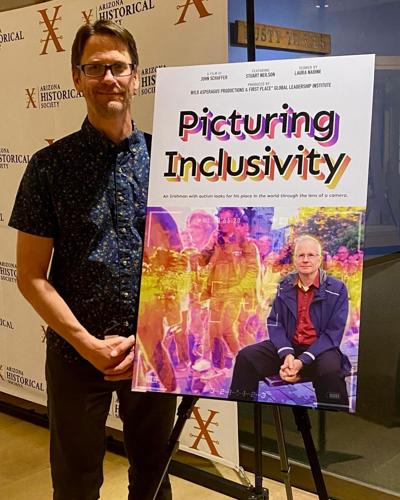 John with the "Picturing Inclusivity" poster