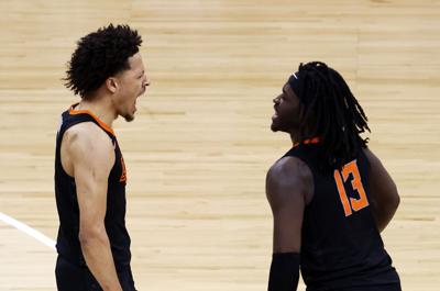 Cade Cunningham and Isaac Likekele of the Oklahoma State Cowboys celebrate as the Cowboys defeat the Baylor Bears 83-74 to win the Big 12 basketball tournament semifinal game at the T-Mobile Center on March 12, 2021 in Kansas City, Missouri.