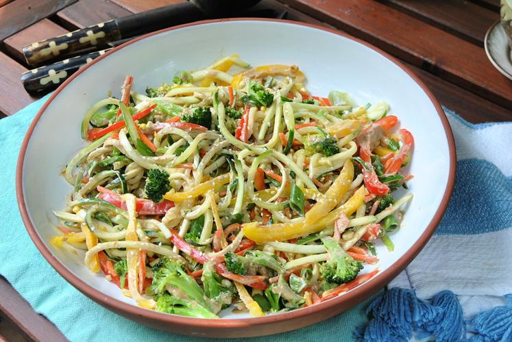 A zucchini noodle salad with an East Asian-inspired tahini-ginger dressing is an easy, low-carb summer dish.