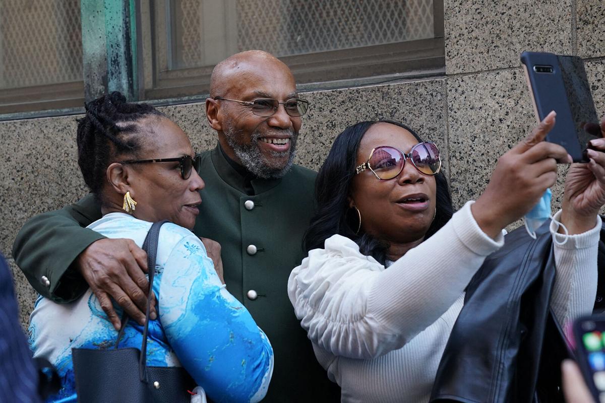 Muhammad Aziz poses for photos outside the courthouse after his conviction in the killing of Malcolm X was vacated, on Nov. 18, 2021 in New York.
