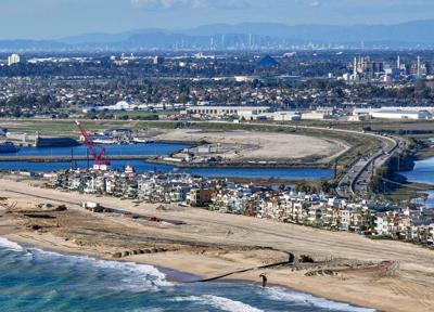 The U. S. Army Corps of Engineers works on a $23 million sand replenishment project at Surfside beach in Seal Beach, California, on Feb. 15, 2024.