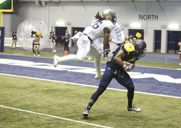 Northern Arizona University wide receiver Dejzon Walker (5) completes a pass on his way to a touchdown against Montana State Saturday. (Taylor Mahoney/Arizona Daily Sun)