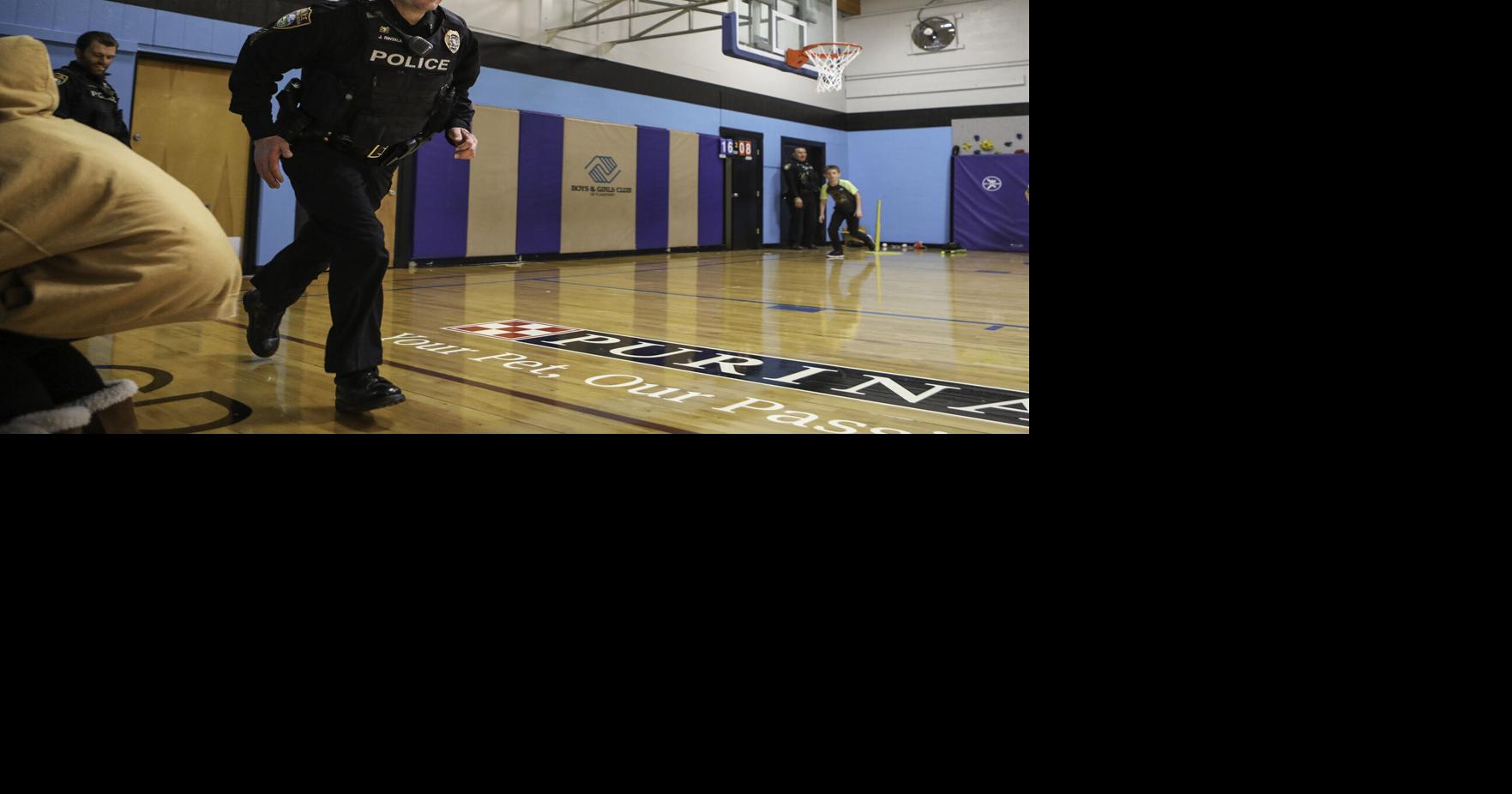 Having a ball Flagstaff police volunteer at local Boys and Girls Club