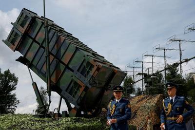 FILE PHOTO: Members of the Honour Guard walk next to a launcher of a Patriot air defence system after marking the Day of the Ukrainian Air Forces an undisclosed location in Ukraine