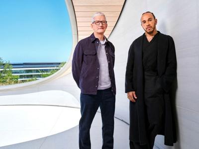 Apple CEO Tim Cook and Formula One driver Lewis Hamilton pose for a publicity photo at Apple Park in Cupertino
