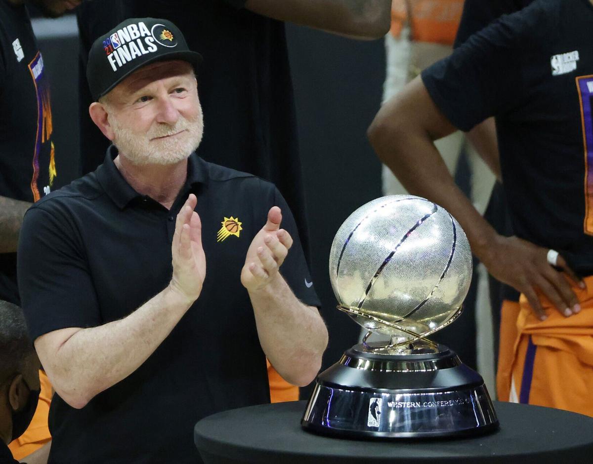 Phoenix Suns owner Robert Sarver stands with the Western Conference Championship trophy after the Suns eliminated the Los Angeles Clippers in Game 6 of the Western Conference Finals at Staples Center on June 30, 2021, in Los Angeles.