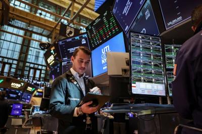 A trader works on the floor at the New York Stock Exchange (NYSE) in New York City