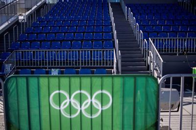 This picture shows the Olympic Rings and empty seats at the Sea Forest Waterway rowing venue ahead of the 2020 Olympic Games in Tokyo on July 18, 2021.
