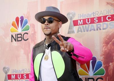 FILE PHOTO: Chris Brown poses at 2015 iHeartRadio Music Awards in Los Angeles