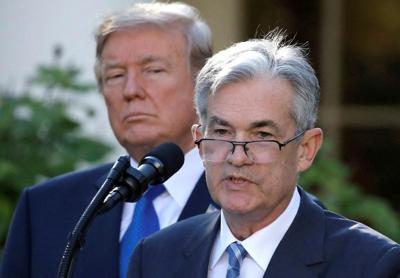 FILE PHOTO: U.S. President Donald Trump looks on as Jerome Powell, his nominee to become chairman of the U.S. Federal Reserve, speaks at the White House in Washington