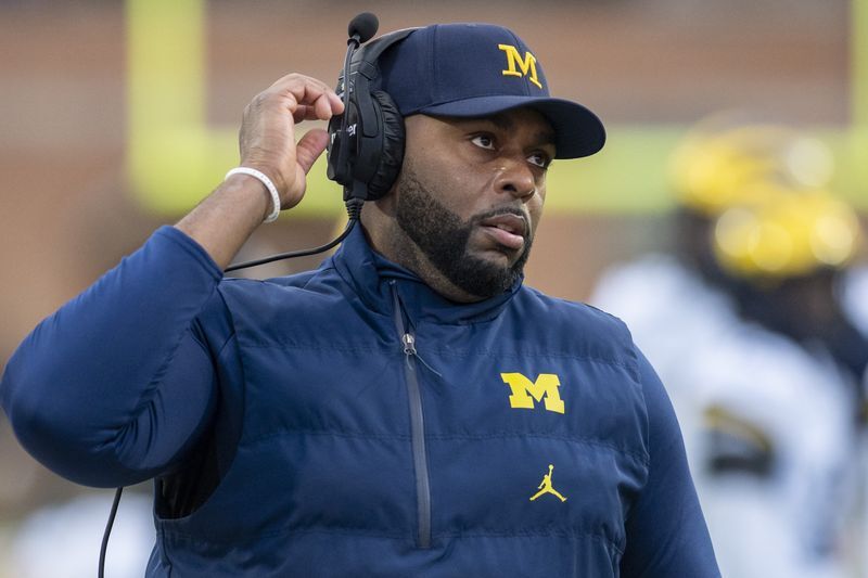 Ex-Michigan coach Moore charged with stalking, home invasion | |  azdailysun.com