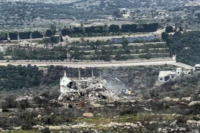 An Israeli military bulldozer works on the Lebanese side of the border between Israel and Lebanon, as seen from Israel