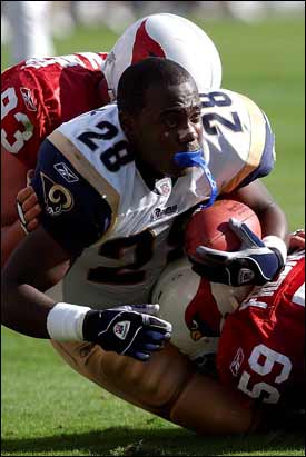 St. Louis Rams' James Hodgins (42) dives into the end zone for a