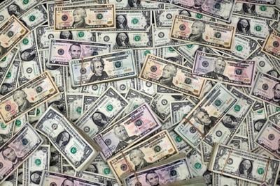 FILE PHOTO: U.S. dollar banknotes are seen in this photo illustration