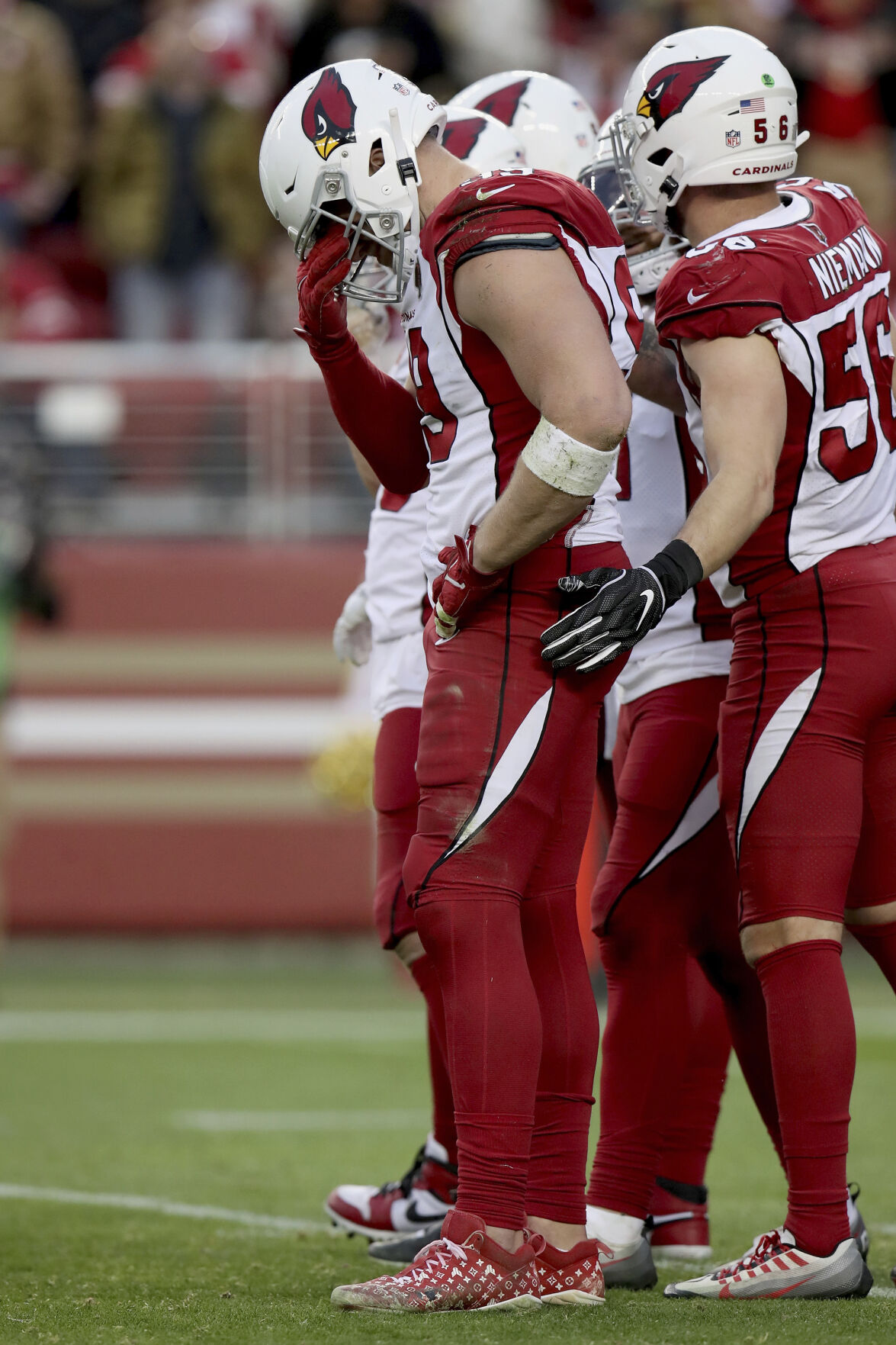 Arizona Cardinals defensive end J.J. Watt wears a shirt for Damar Hamlin  during warms up before an NFL football game against the San Francisco 49ers  in Santa Clara, Calif., Sunday, Jan. 8