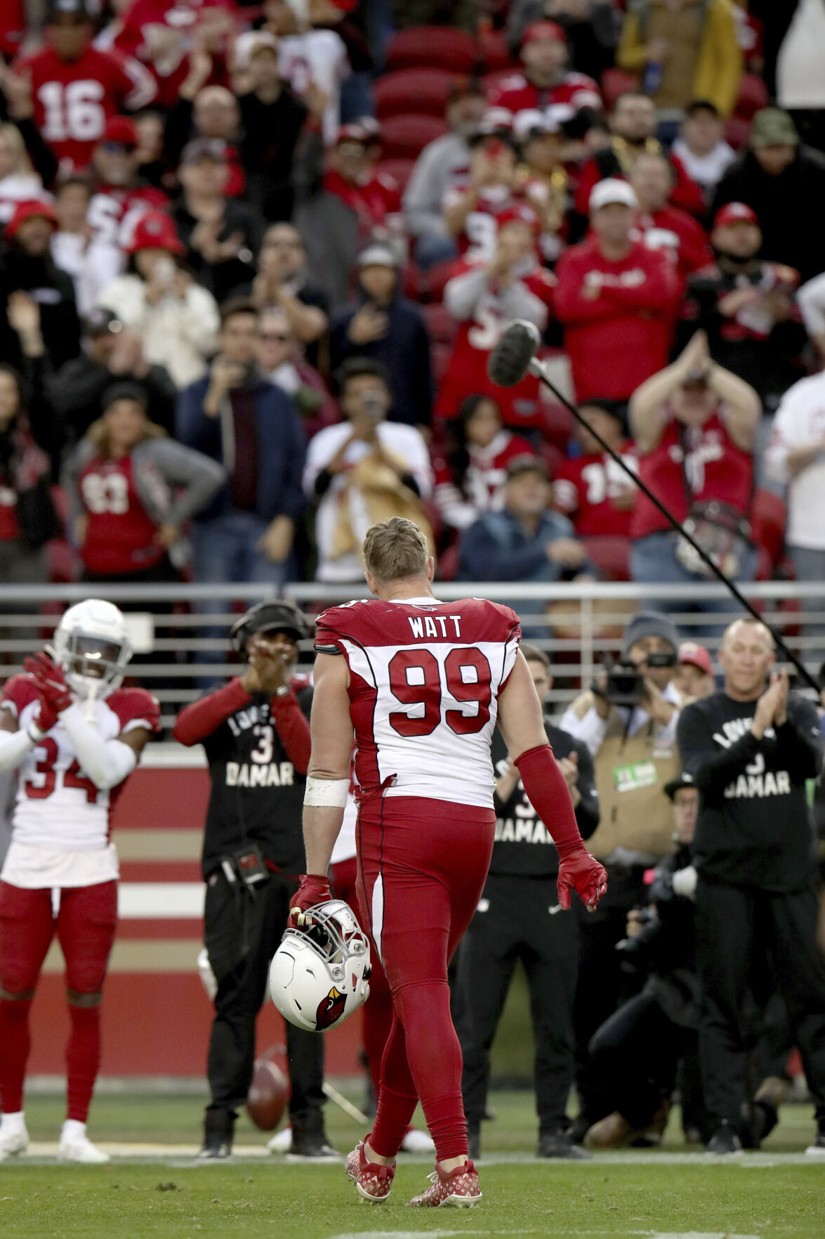 Arizona Cardinals defensive end J.J. Watt wears a shirt for Damar Hamlin  during warms up before an NFL football game against the San Francisco 49ers  in Santa Clara, Calif., Sunday, Jan. 8