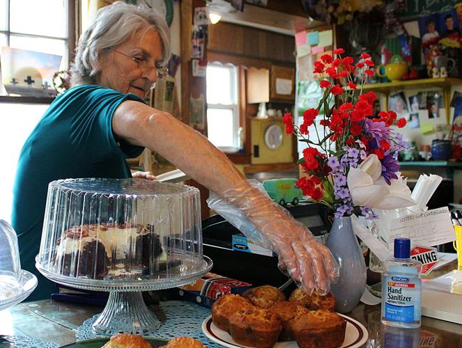 Sisters Coffeeshop Gwen Ramey serves customer