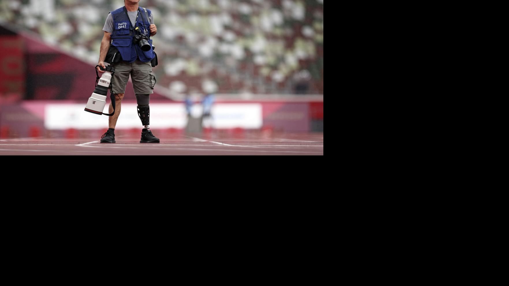 Photographer, his leg lost, seeks answers from Paralympians