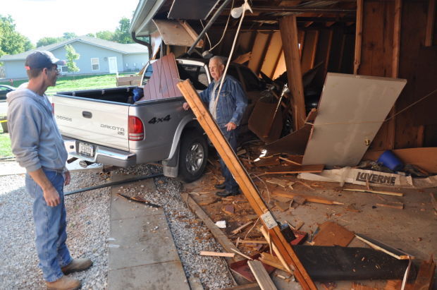 Truck crashed through apartment garage Thursday morning