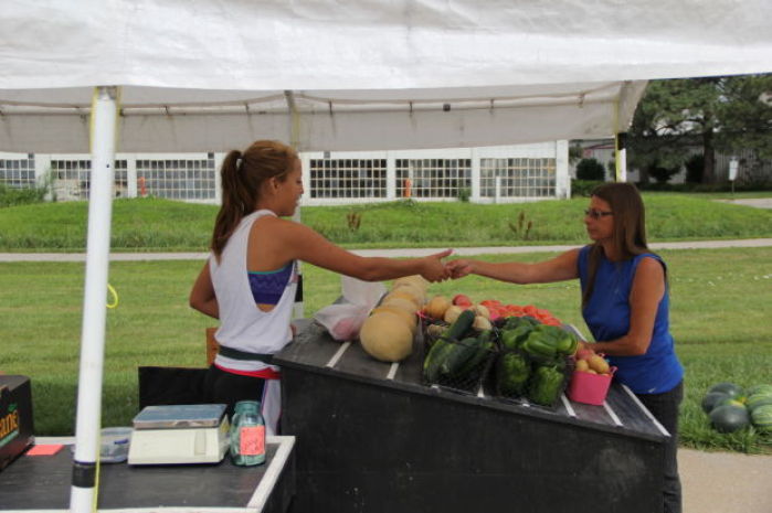 Produce seller working her way through school