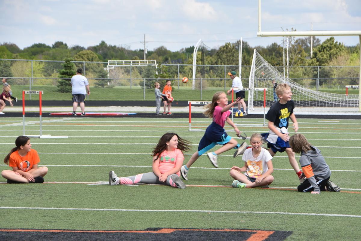 Paddock Lane students walk the track to celebrate fundraising efforts
