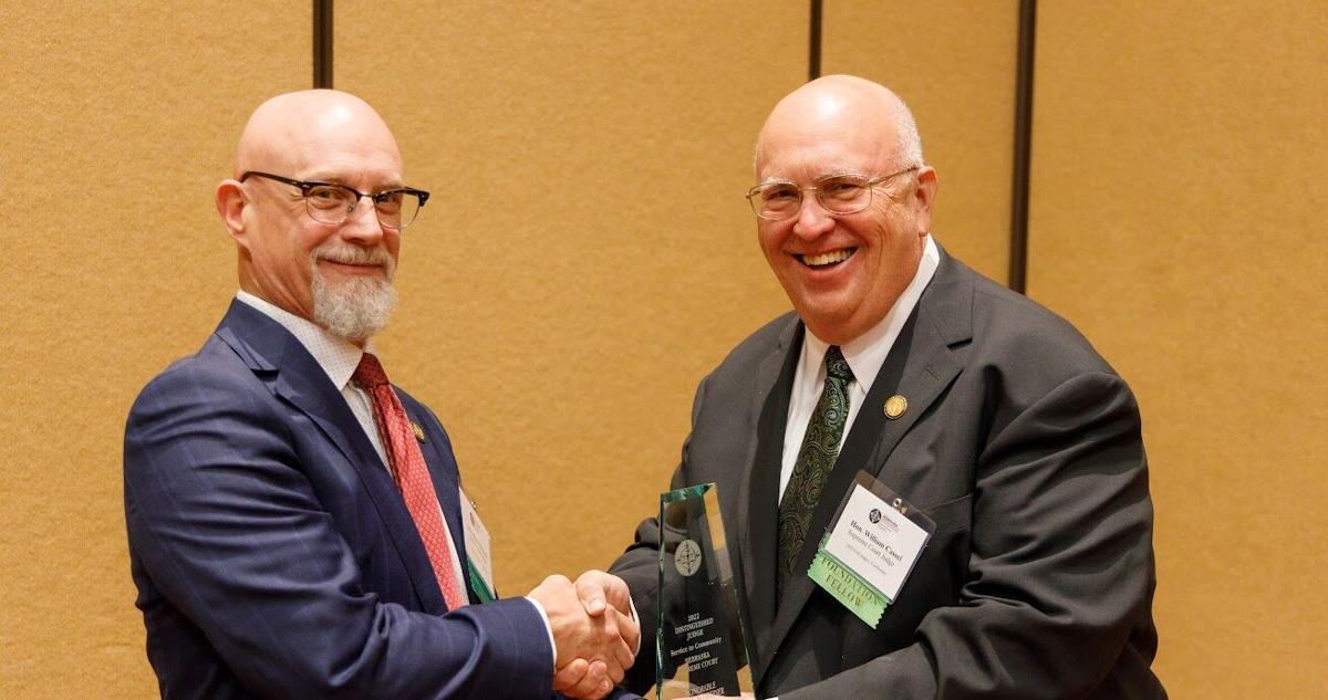 Judge R. Ellis District Court judge receives award