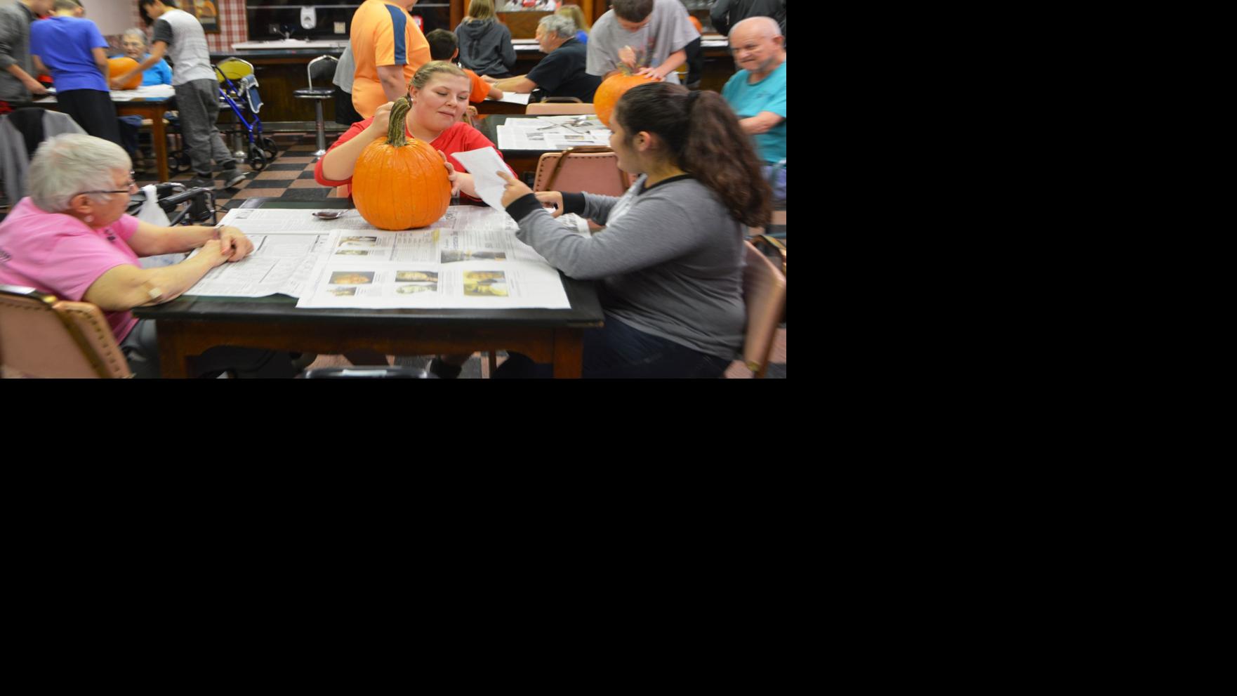 BMS students spend afternoon carving pumpkins with foster grandparents