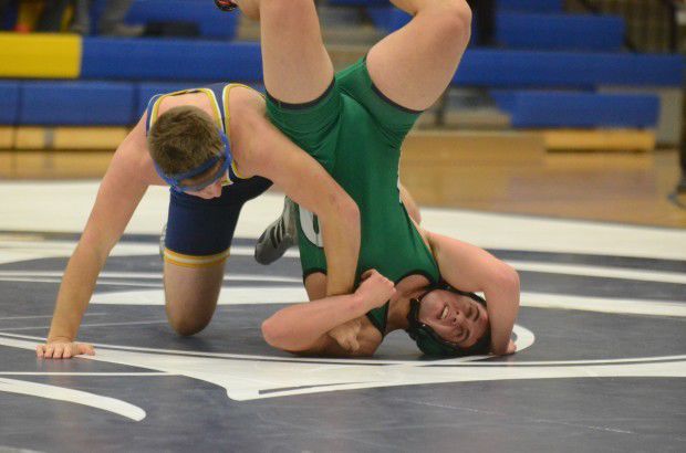 Wolverines down Trojans in wrestling dual