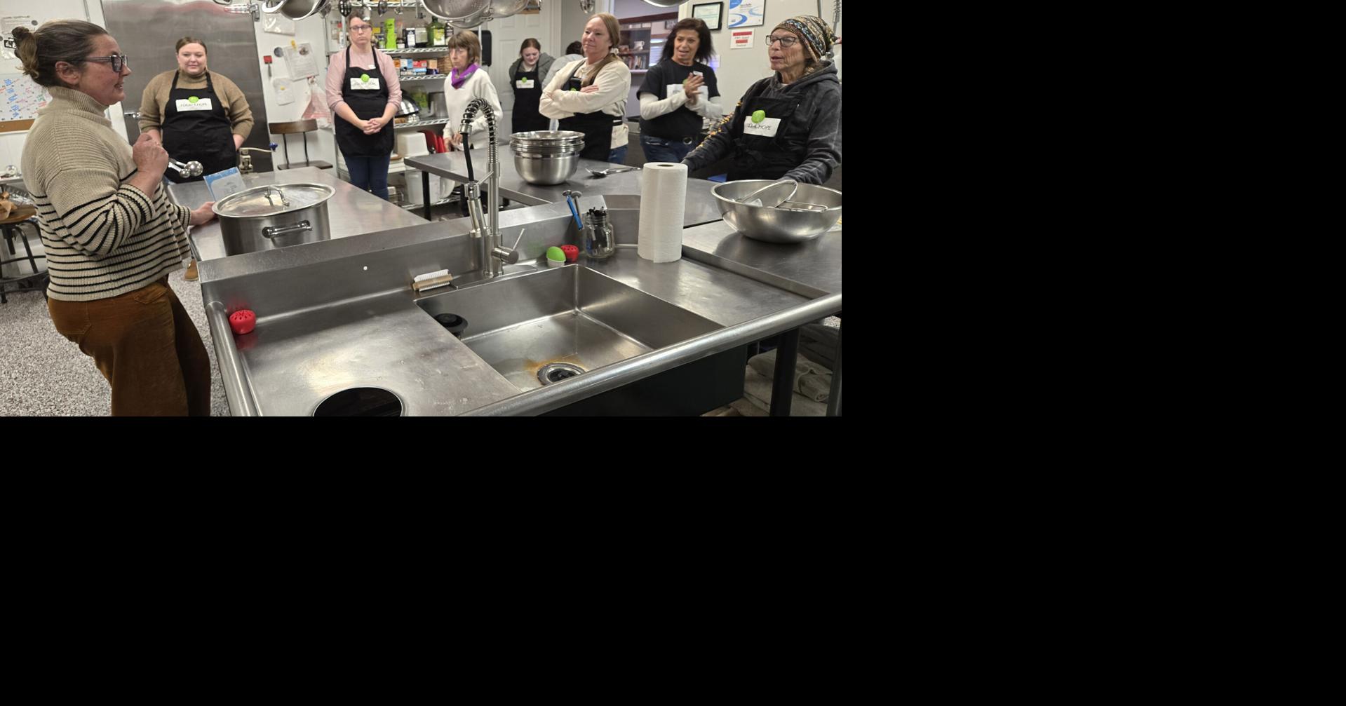 Photos: Cheesemaker guides group in creating mozzarella