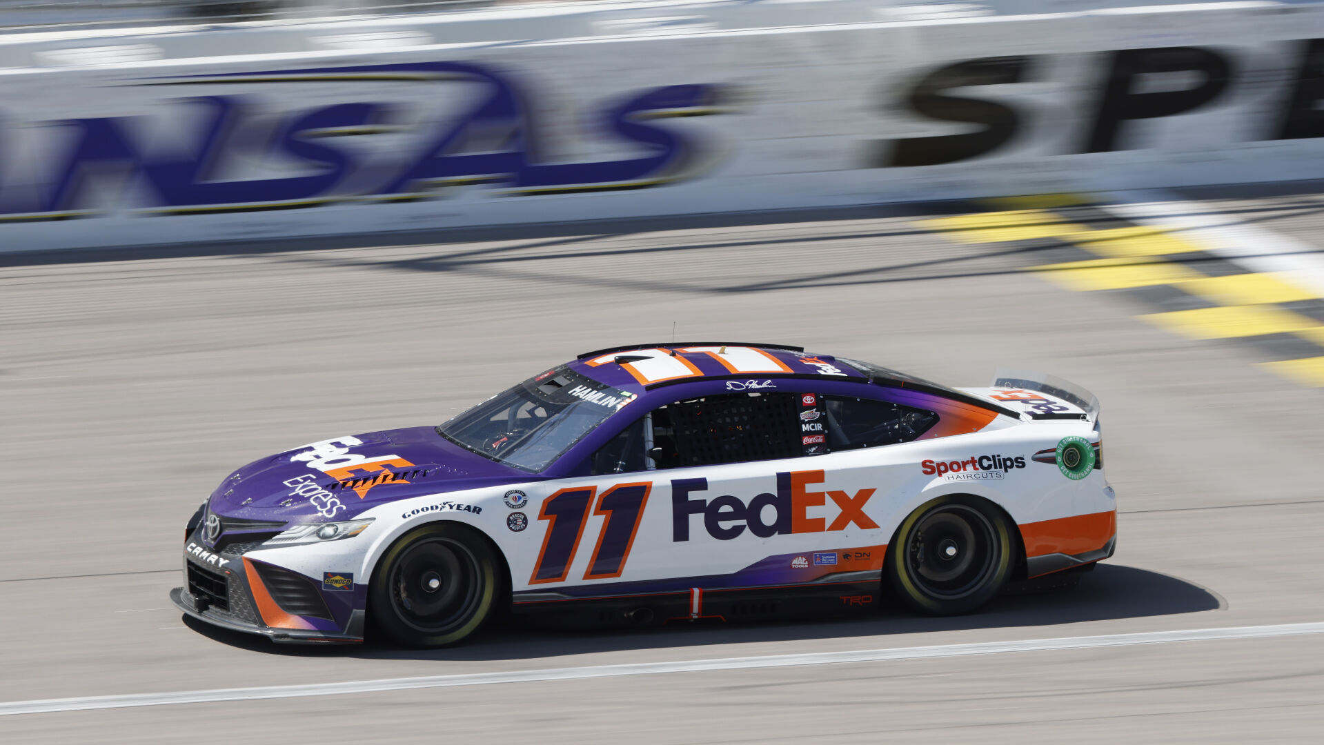 Hamlin bumps Larson for lead on final lap to win at Kansas