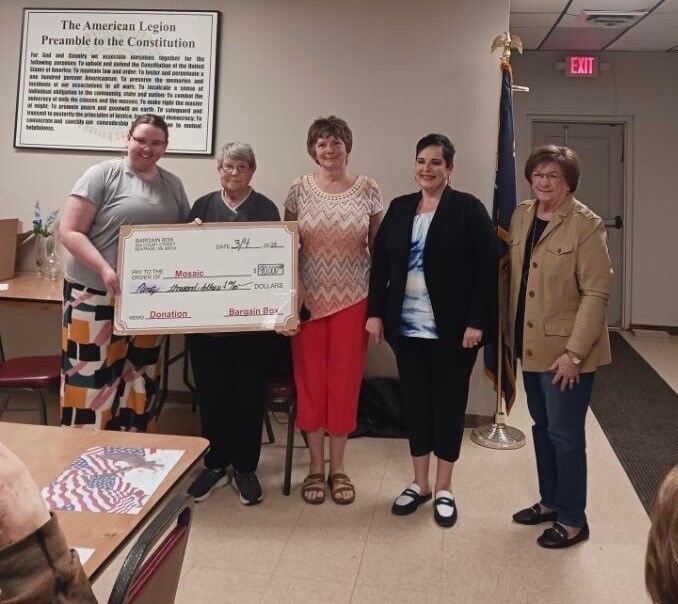 Bargain Box presents check to Mosaic