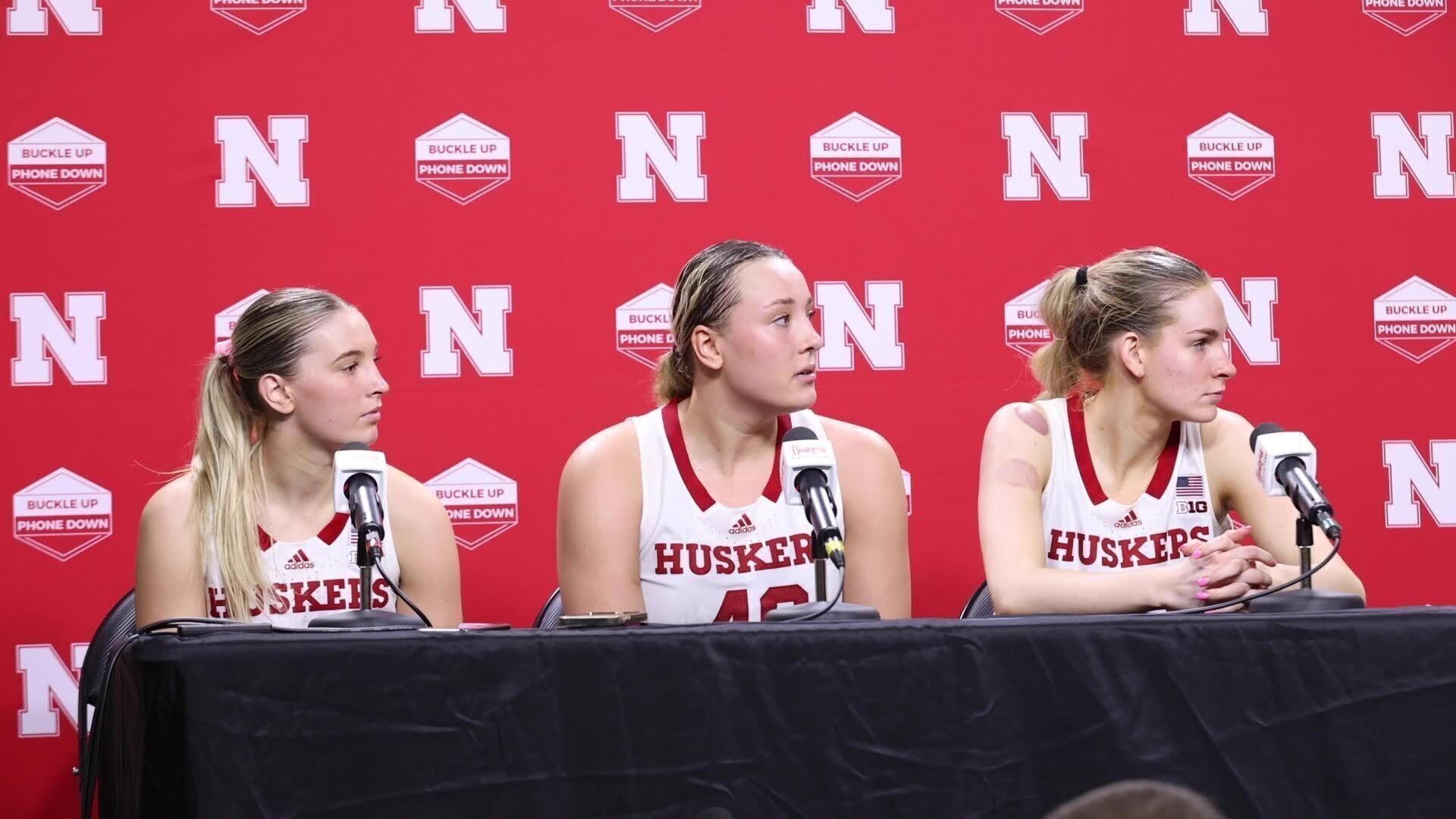 Iowa head coach Lisa Blunder comments outside Huskers press conference