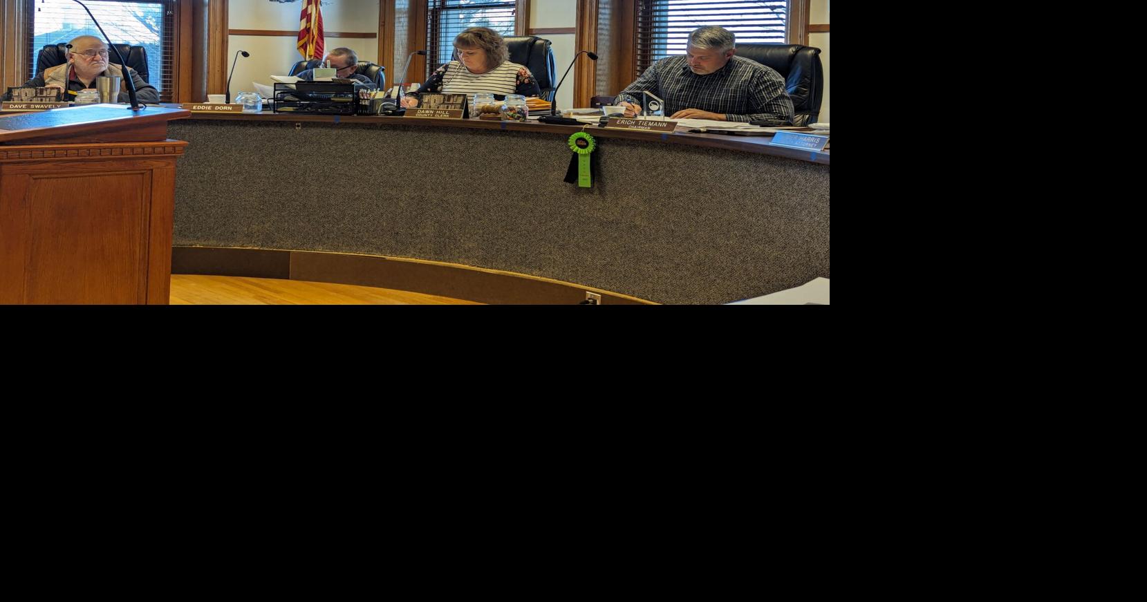 Members of the public discuss zoning regulations with County Board