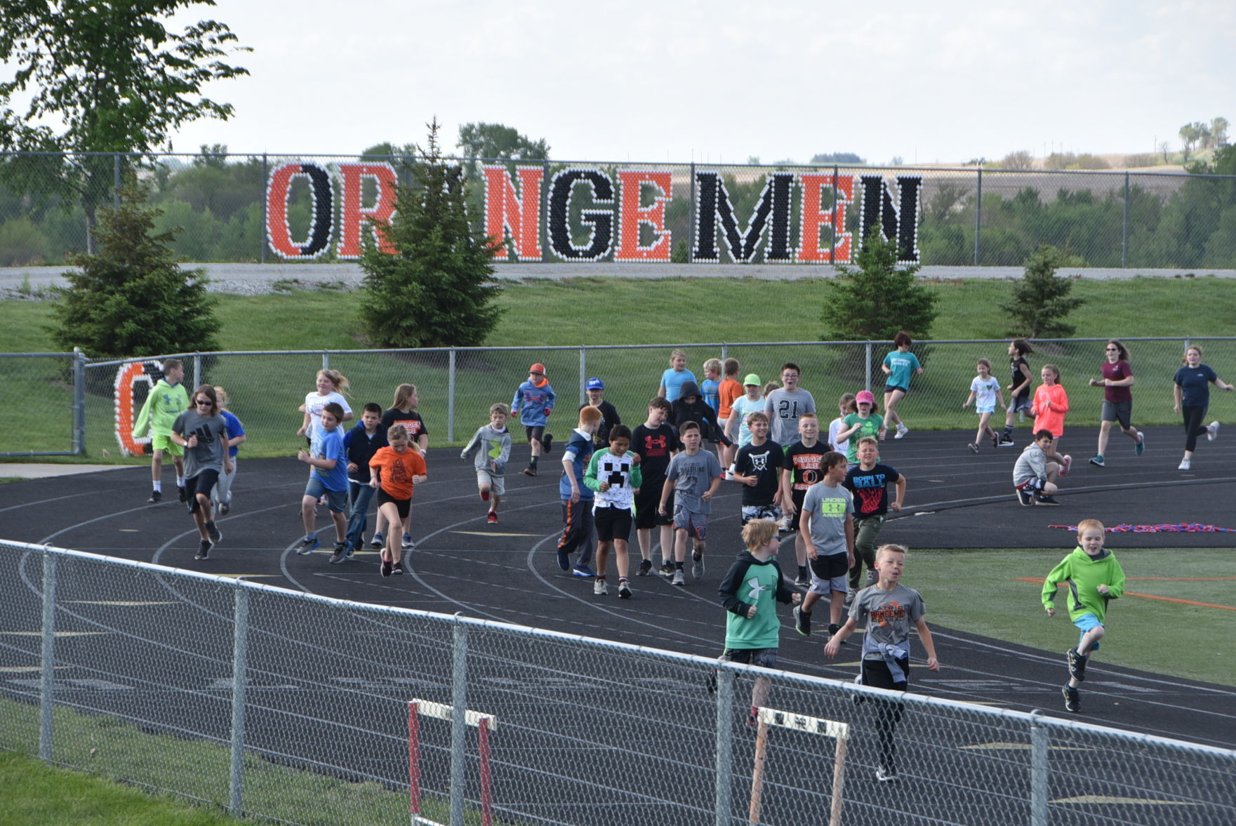 Paddock Lane students walk the track to celebrate fundraising efforts