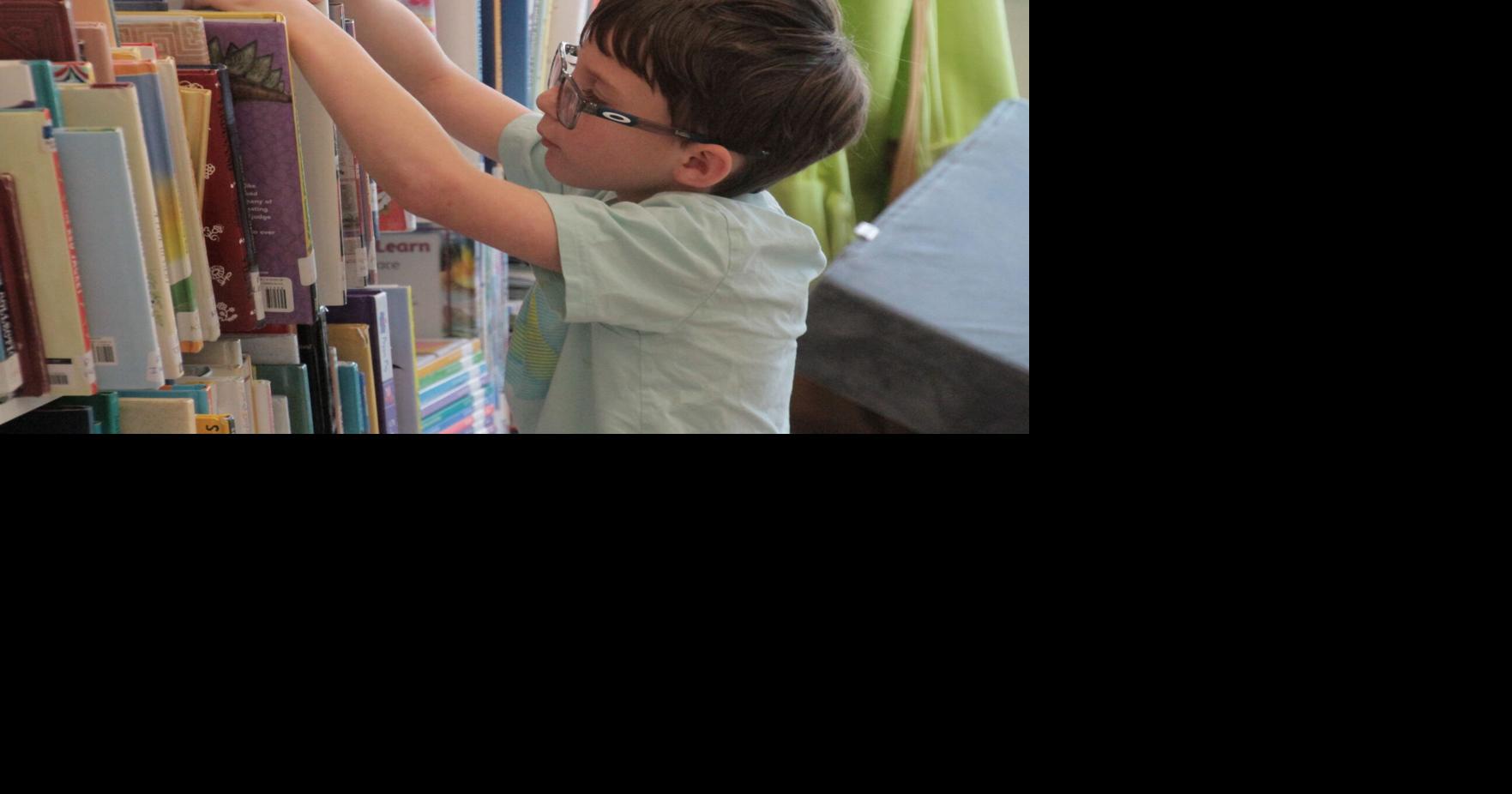 Photos: Youths learn about bugs at Odell Library