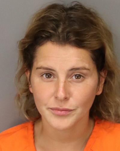 Woman arrested after climbing fence, stealing Coast Guard tricycle and ...