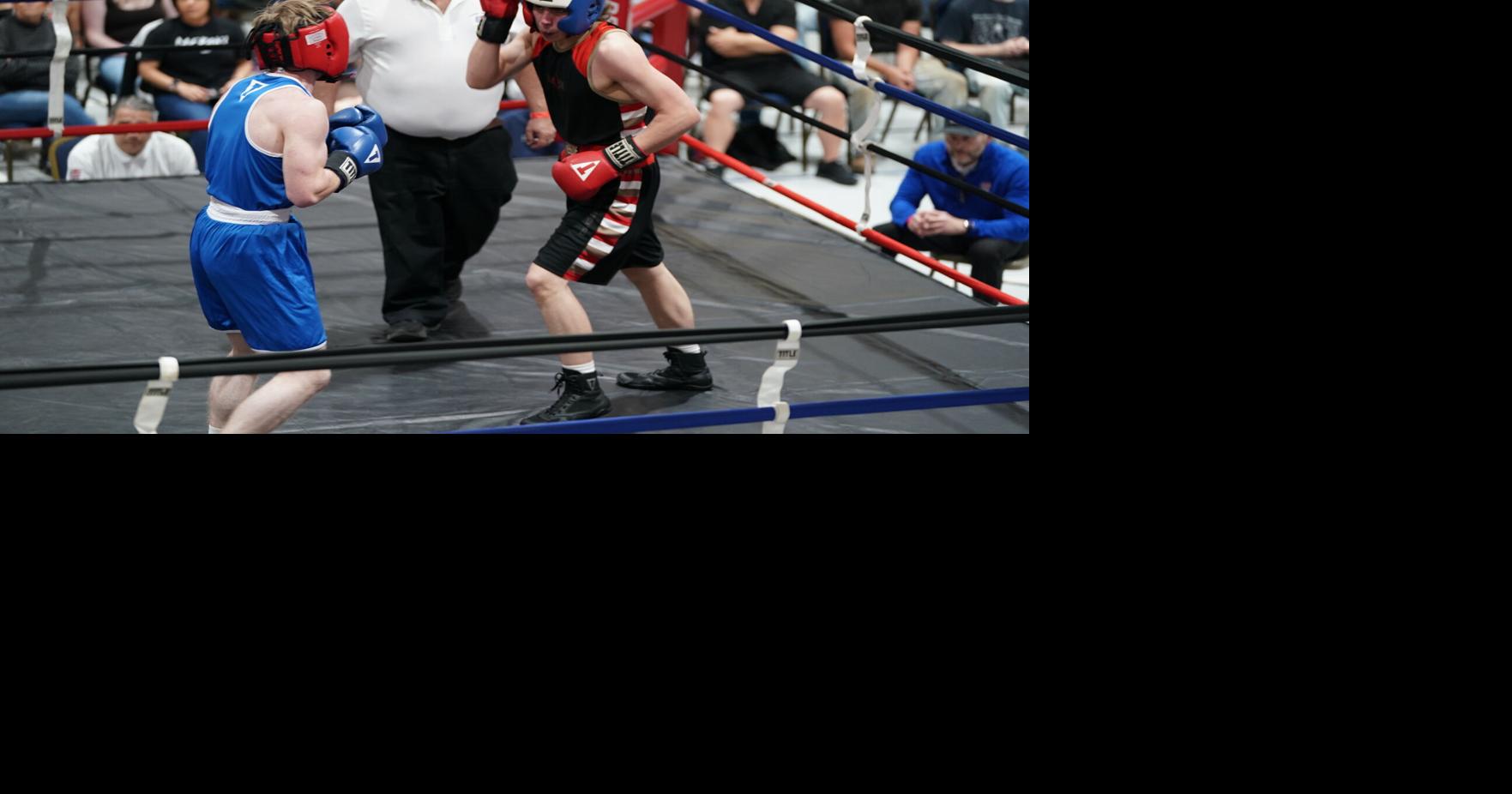 Bradley Wills of Dominion Boxing Hits Benjamin Thunder Hawk of Rapid City Youth Boxing